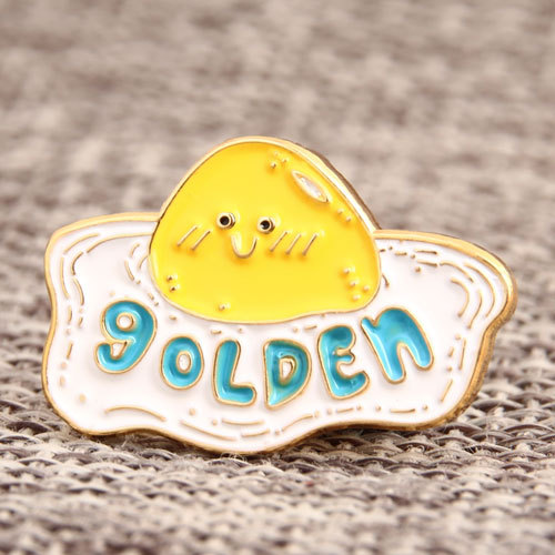 7. Golden Egg Enamel Pins